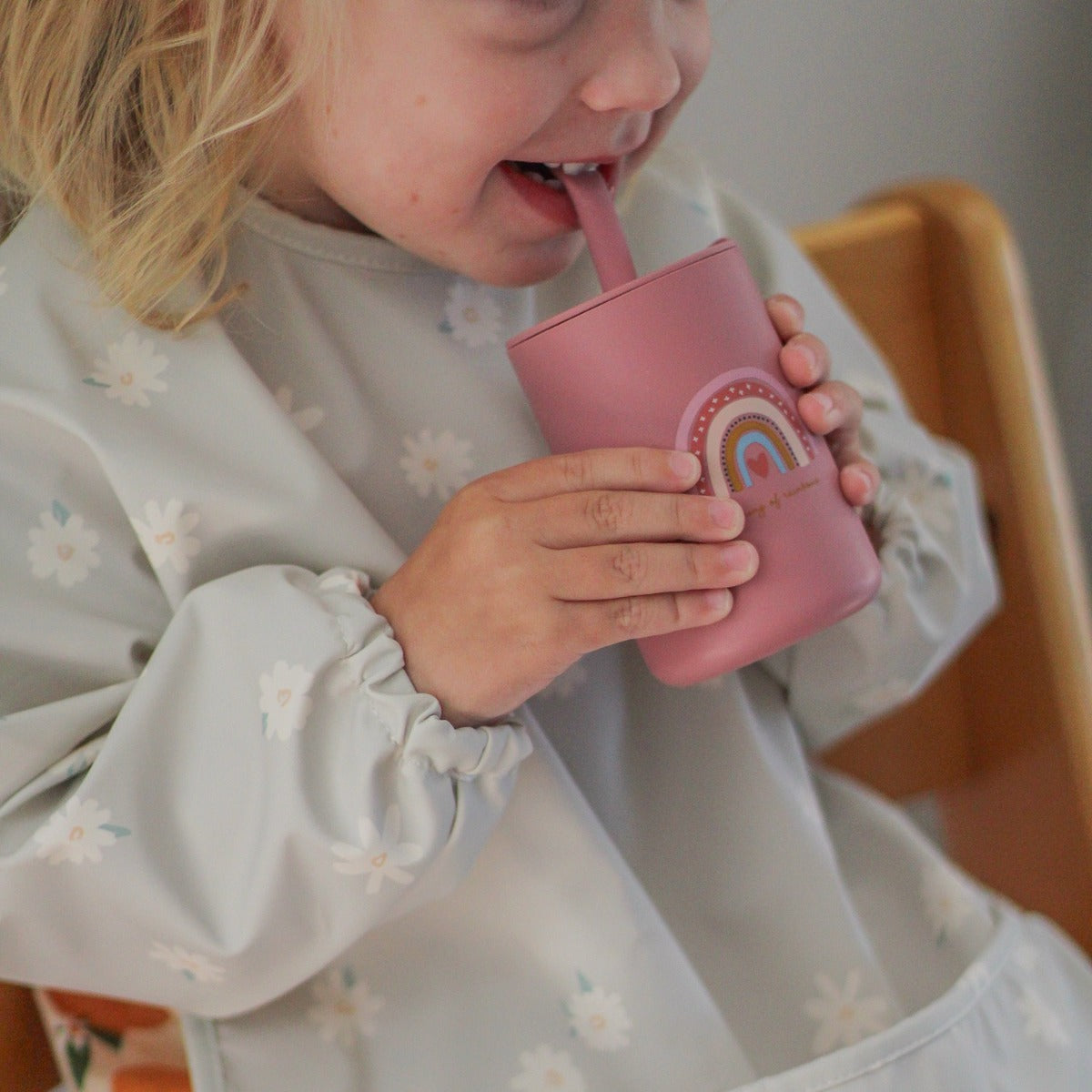 Waterproof long sleeve bib from Over the Dandelions in Daisy print