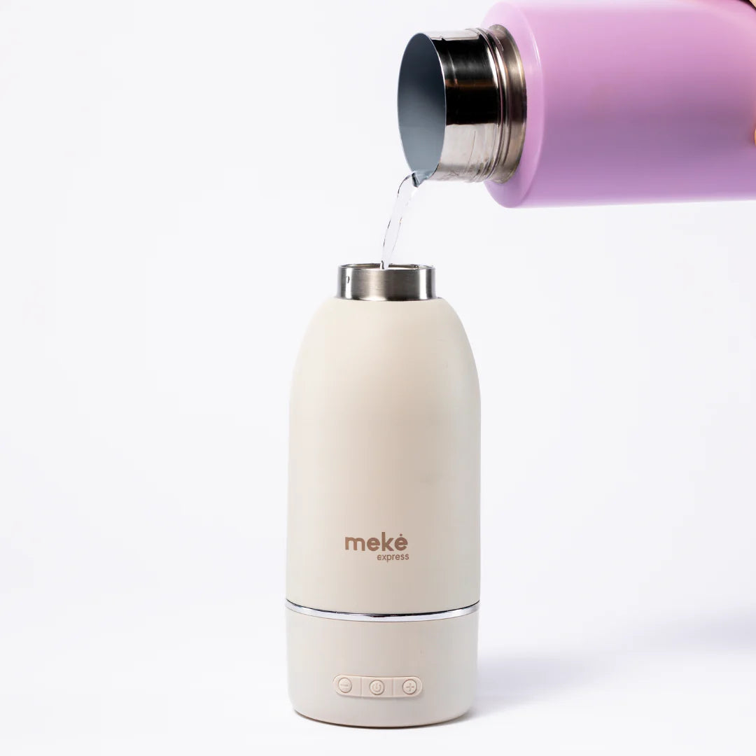 Pouring water in Meke Express Milk Warmer