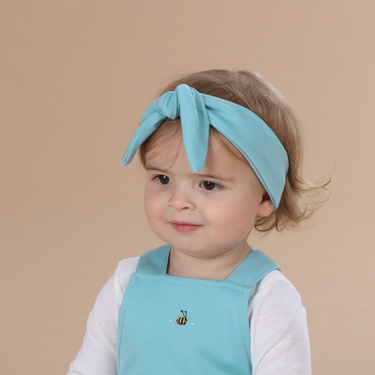 Baby wearing Merino Headband in teal:image,small_image,thumbnail,swatch_image