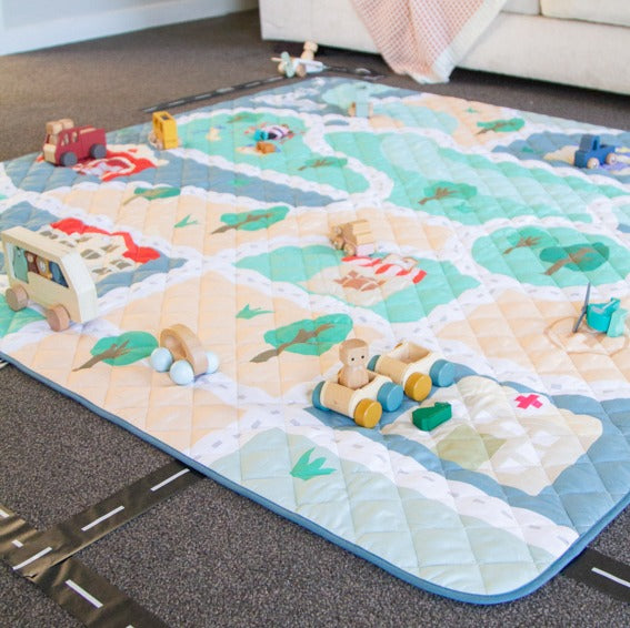 Quilted playmat in tiny town print from Zazi in a room