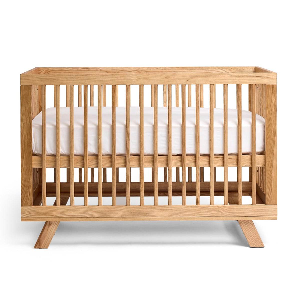 Mackenzie Natural Cot from Cariboo with mattress at a height