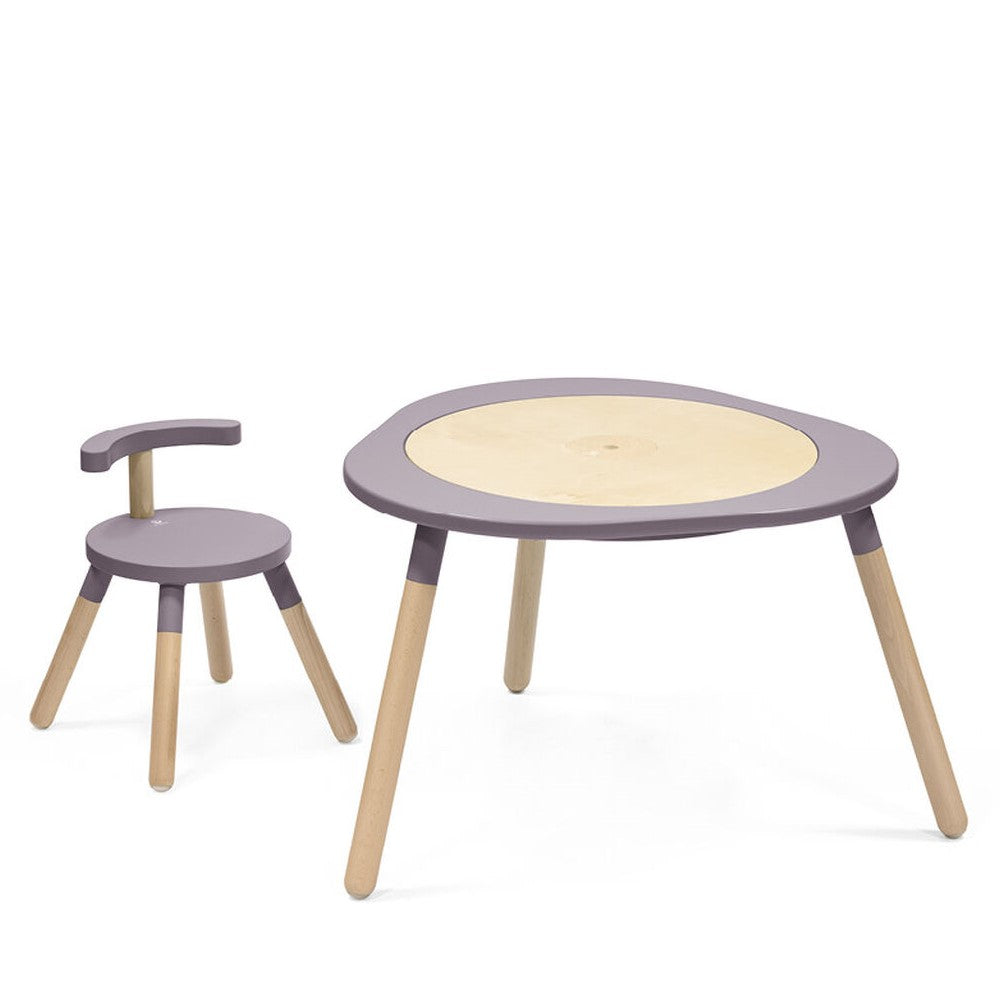 extended MuTable by stokke in Lilac alongside extended chair
