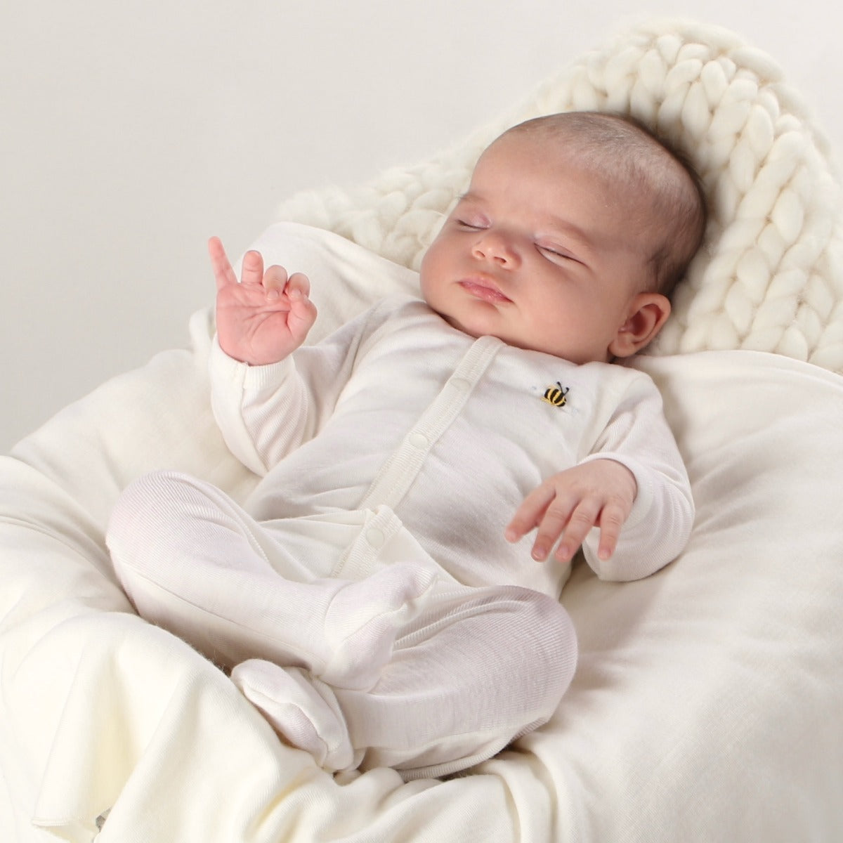 Dimples Classic merino Babygrow in cream Bee on baby