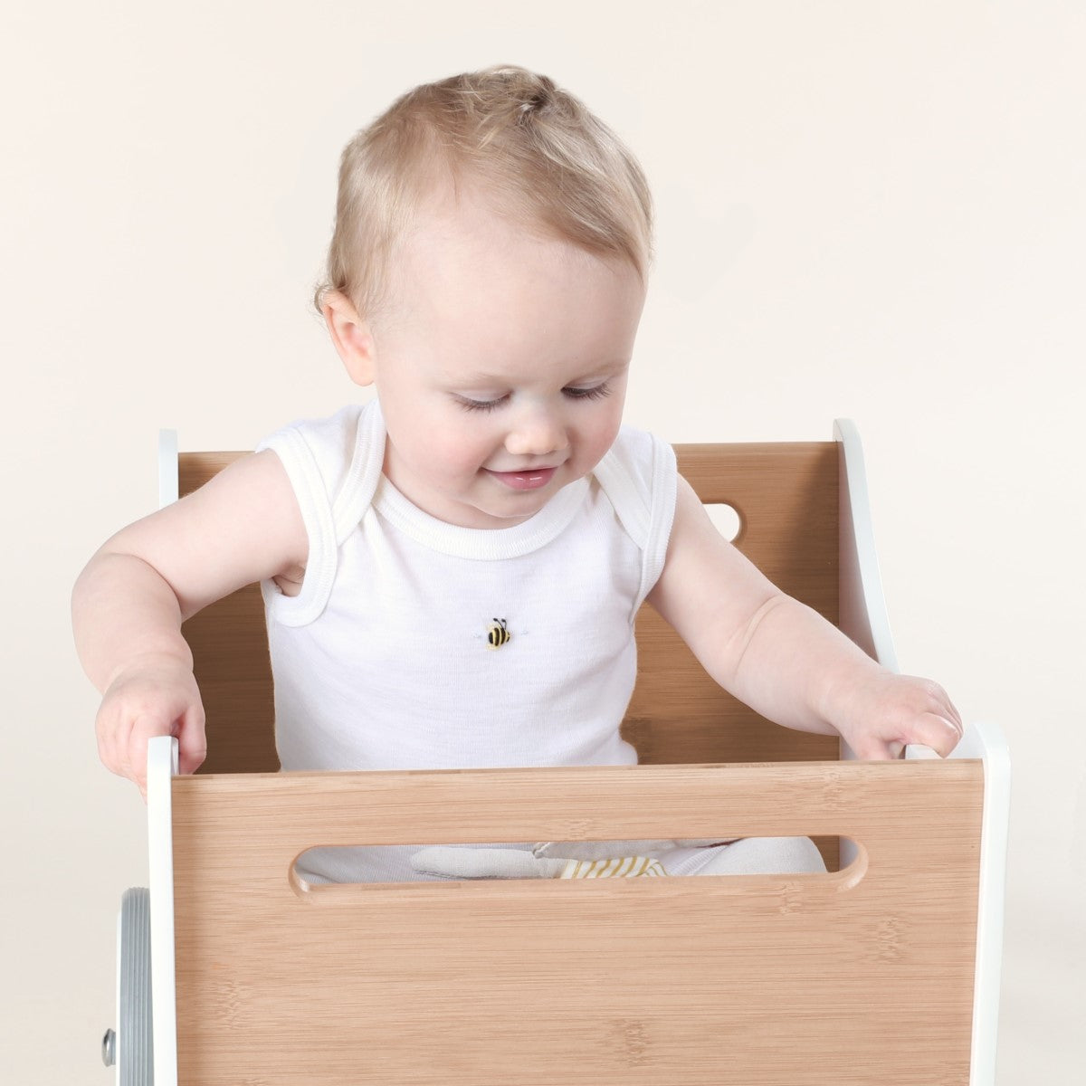 Dimples cream bee sleeveless bodysuit on baby