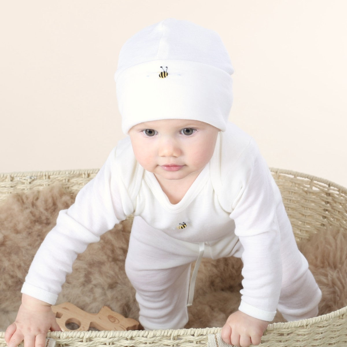 Dimples Cream Bee merino beanie on baby