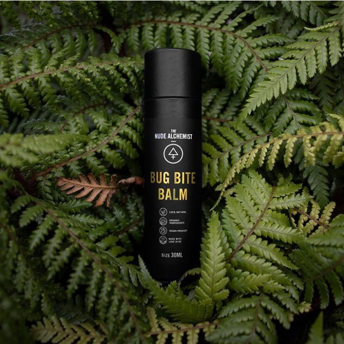 bug bite balm by nude alchemist amongst leaves
