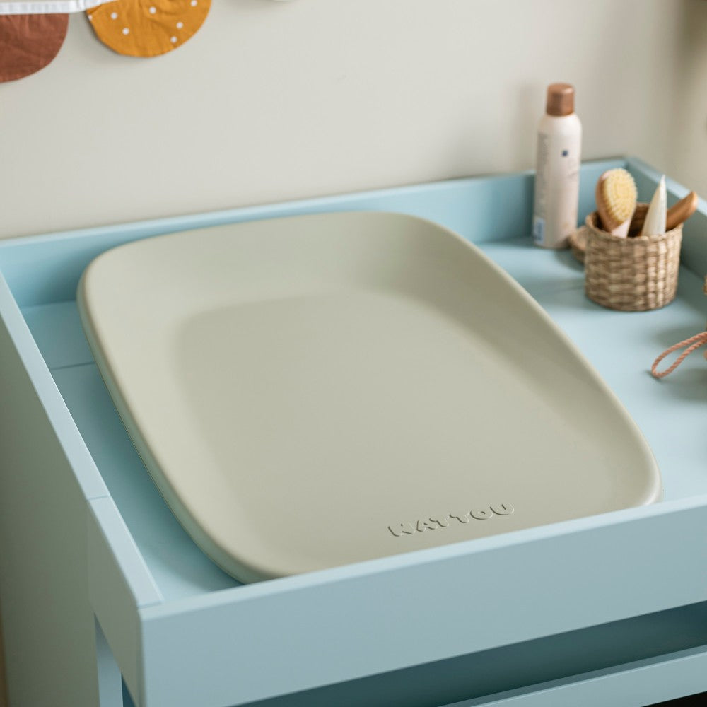 Baby Change Mat from Nattou in green on a change table