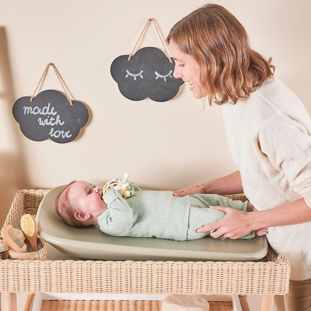Mother and baby enjoting nappy change time with Baby Change Mat from Nattou in green