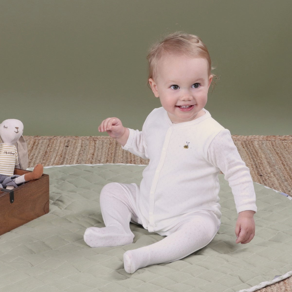 Dimples Cotton Babygrow in white bee on baby