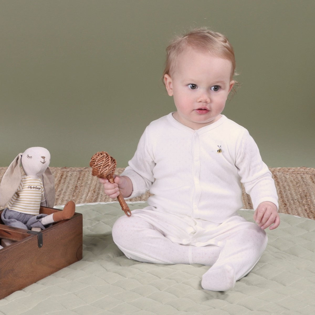 Dimples Cotton Babygrow in white bee on baby