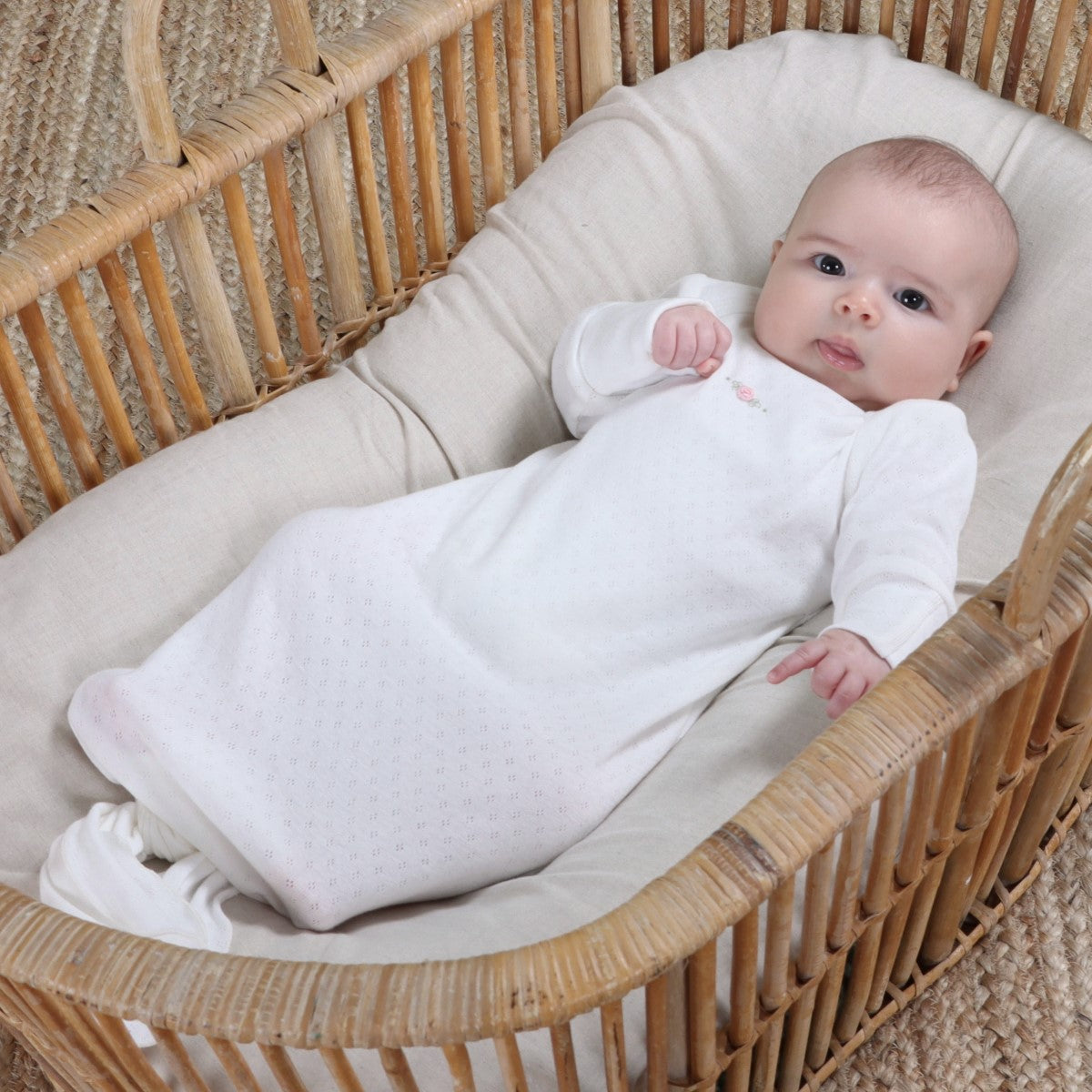 Dimples baby gown in white rose on baby