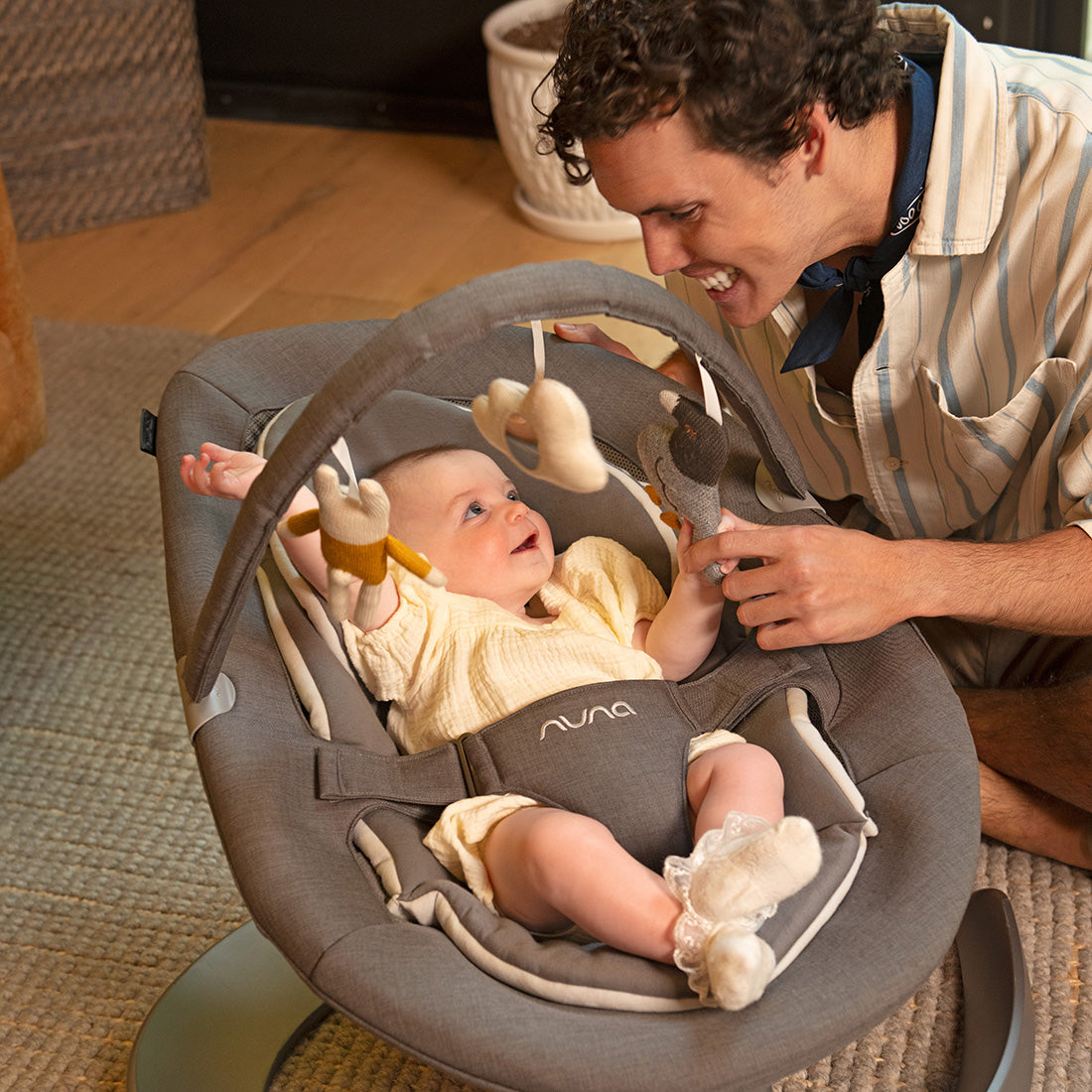 Baby playing in Nuna leaf grow baby bouncer