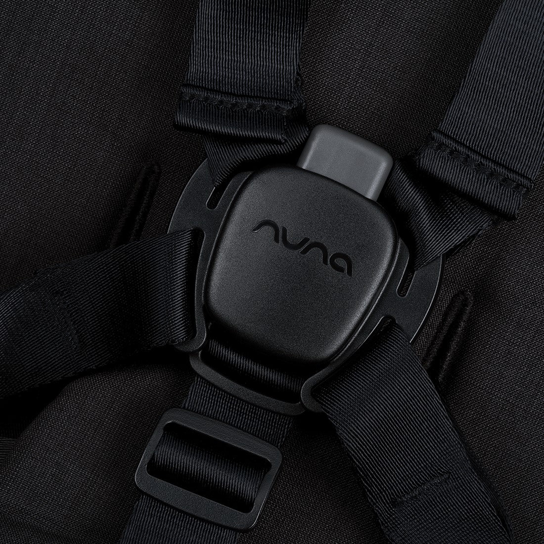 Nuna Triv Next Stroller Caviar Zoomed in View of Buckle