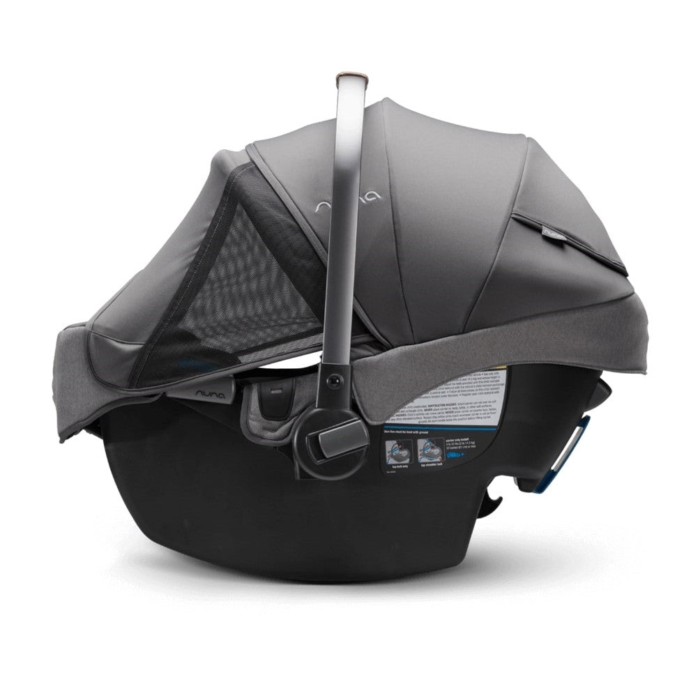 Nuna Pipa RX car seat capsule and relx Base in Granite side view with hood