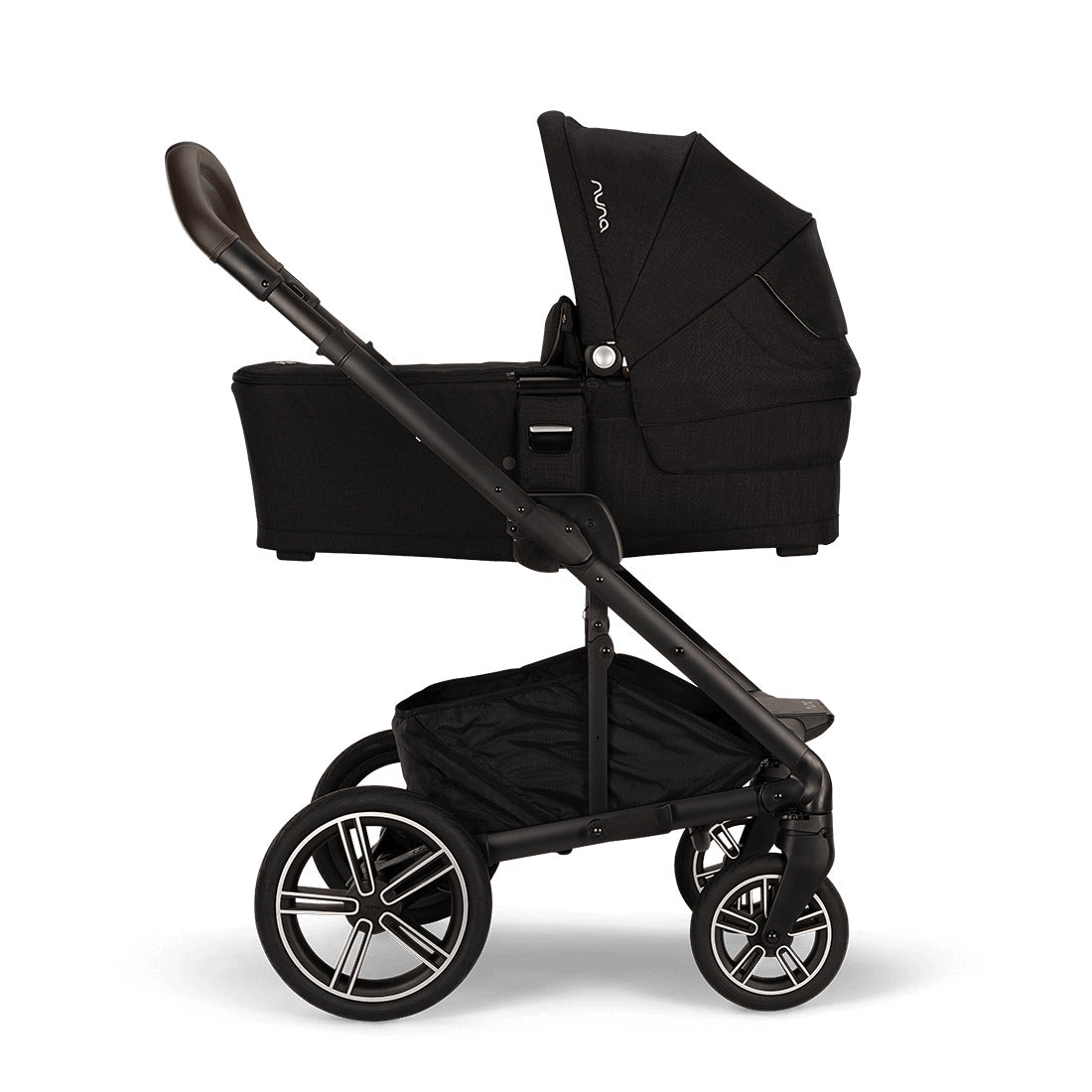 Nuna Mixx Next Stroller with chocolate handle side view with attached carry cot