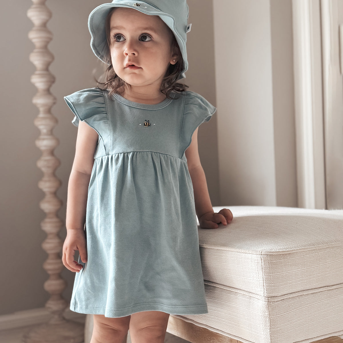Baby girl wearing Cotton frill dress in ocean and bee embroidery with ocean sunhat
