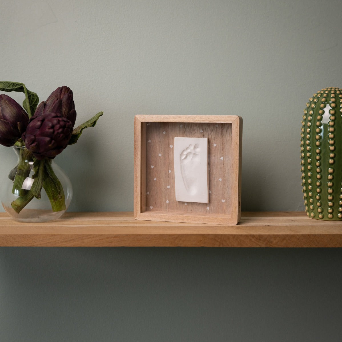 Print Box with Clay imprint of baby on a table