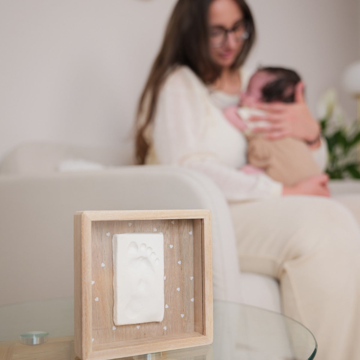 Print Box with Clay imprint of baby on a table