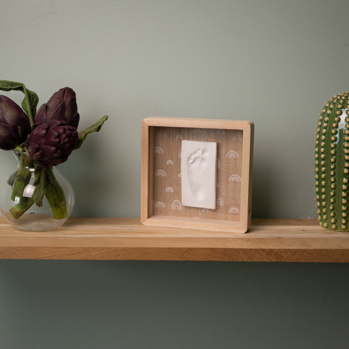 Print Box with Clay imprint of baby on table
