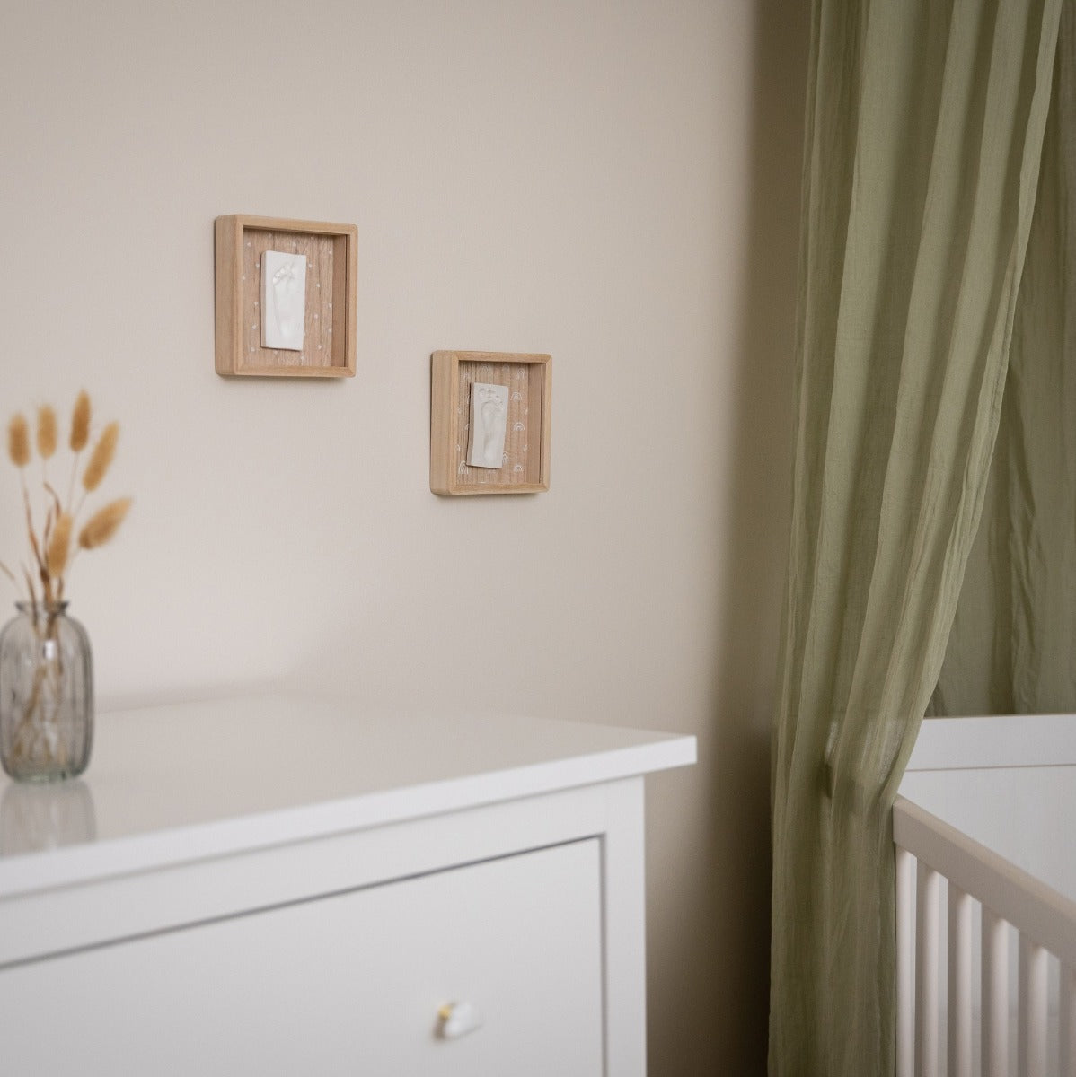 Print Box with Clay imprint of baby hanging on a wall in nursery