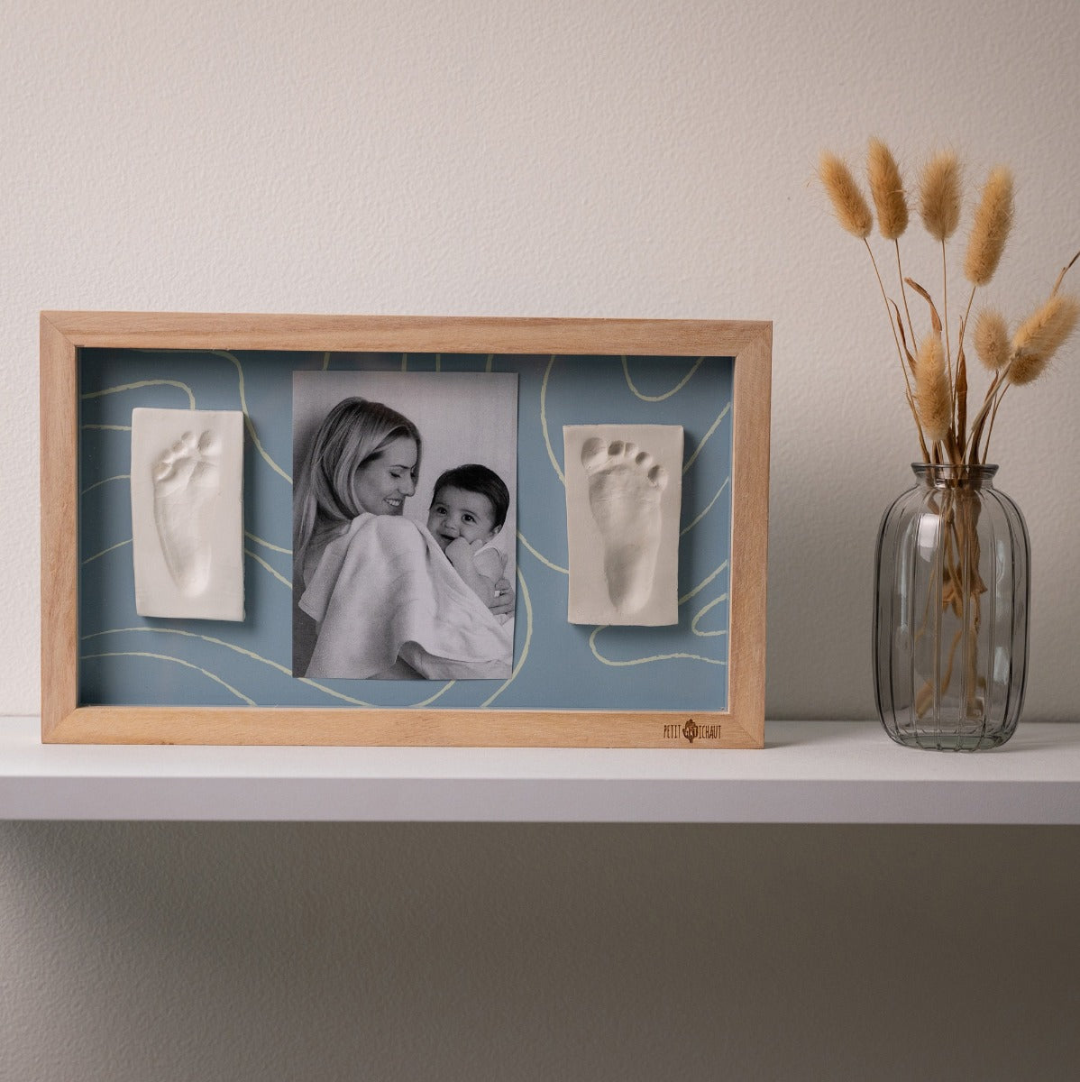 Petit Artichaut 2 Print Frame - Blue Abstract sitting on a shelf 