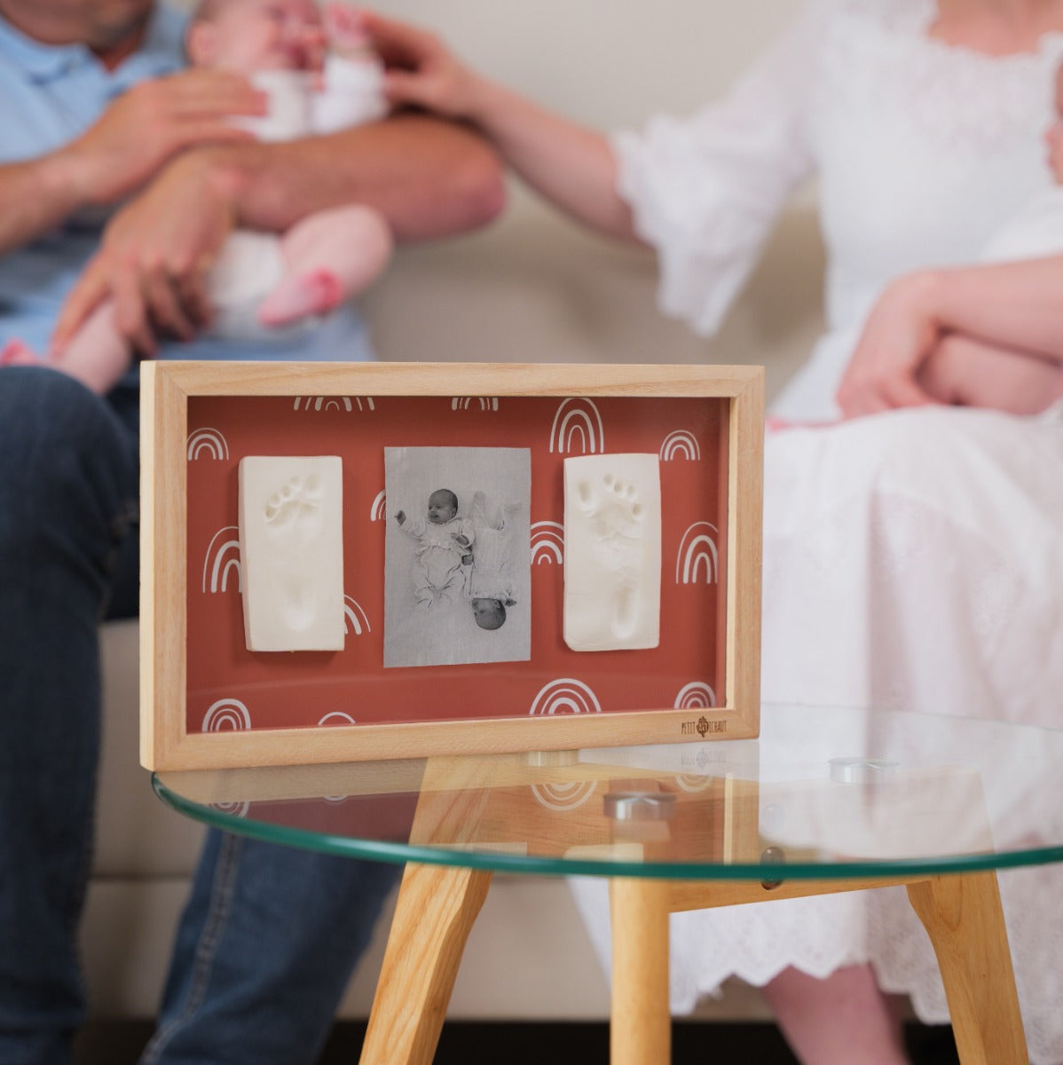 Petit Artichaut 2 Print Frame Rainbow terracotta on a coffee table