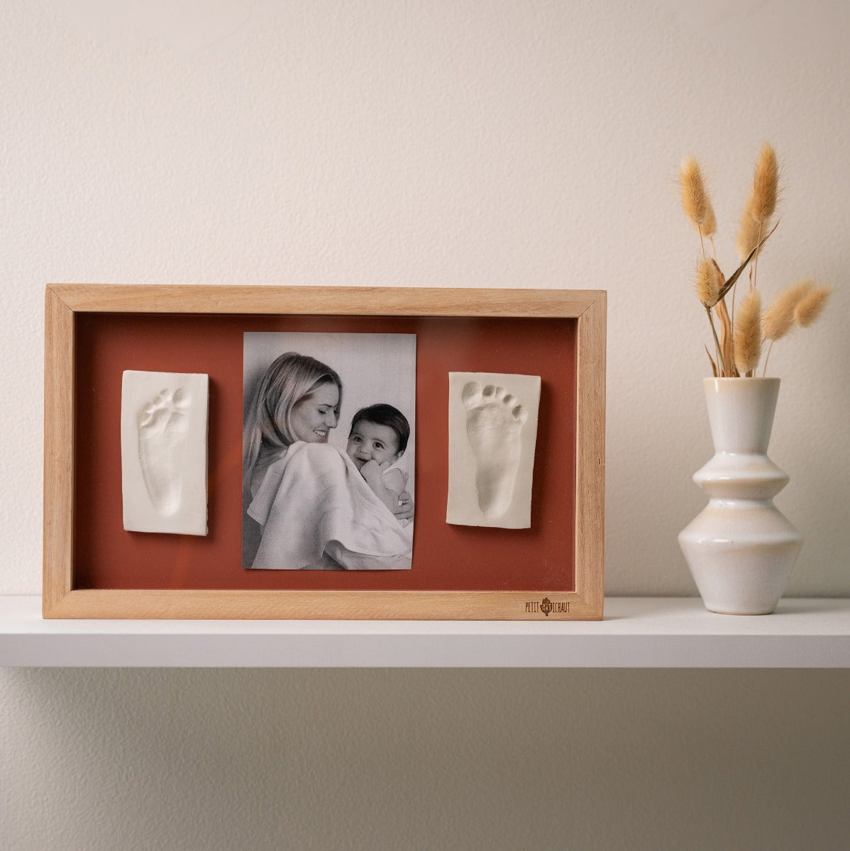 Petit Artichaut 2 Print Frame Rainbow terracotta sitting on a shelf