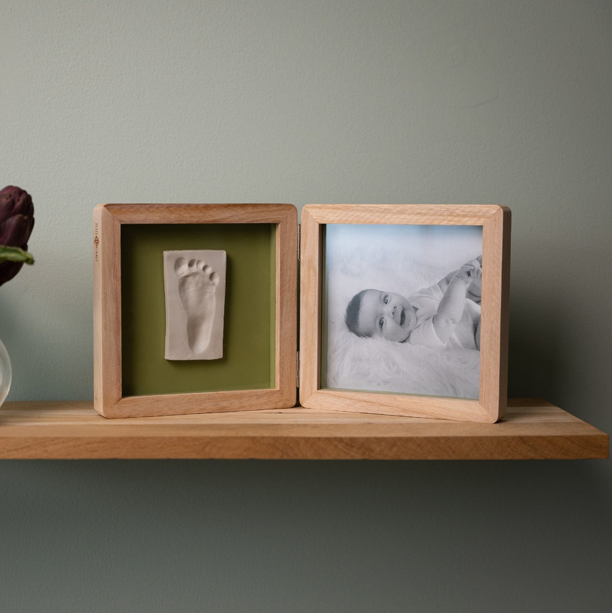 Petit Artichaut double frame olive tree print placed on a shelf 