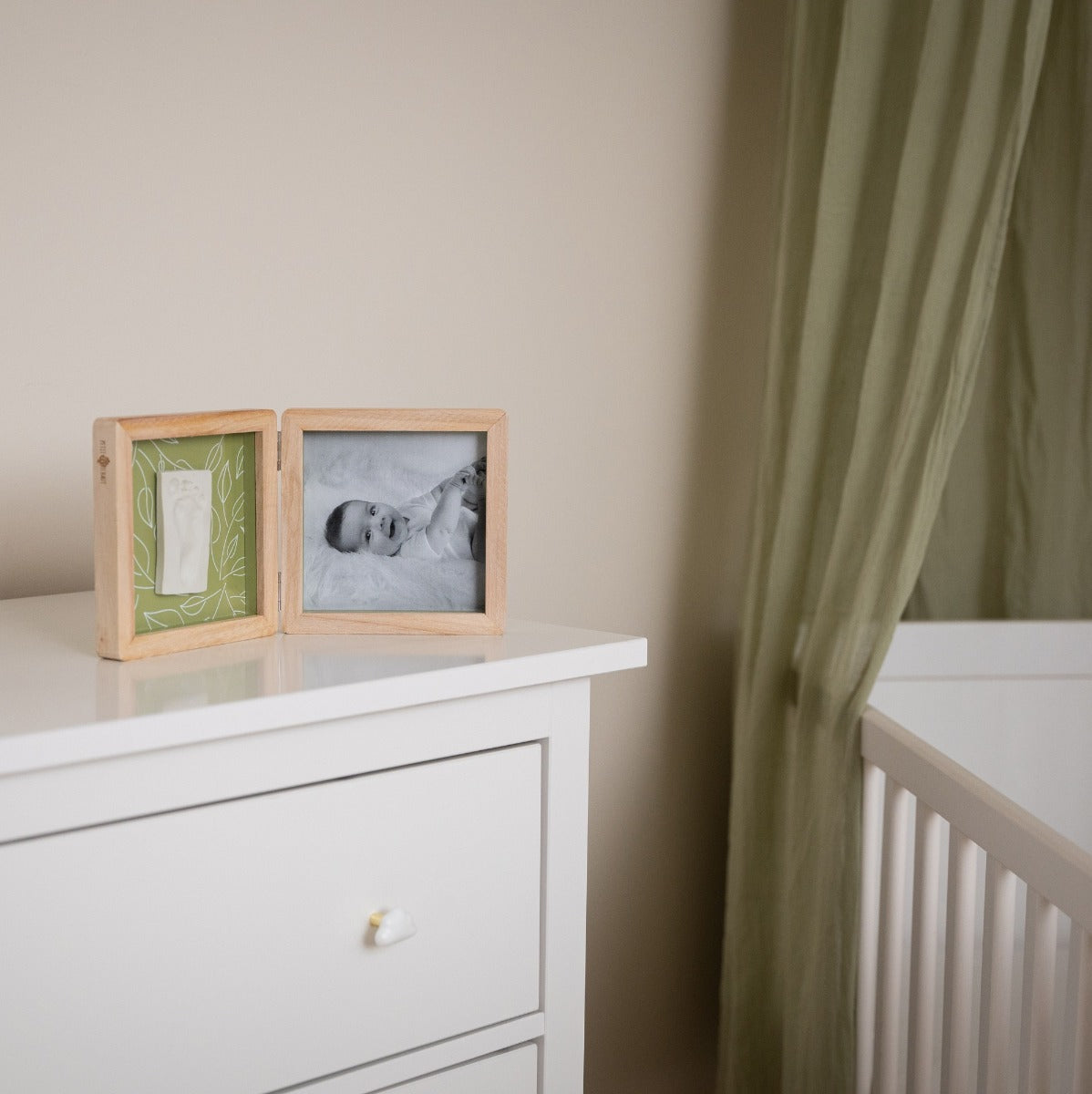 Petit Artichaut double frame olive tree print placed on dresser next to cot 