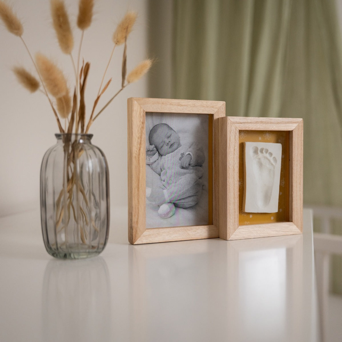 Petit Artichaut 2 frames baby imprint keepsake on a table