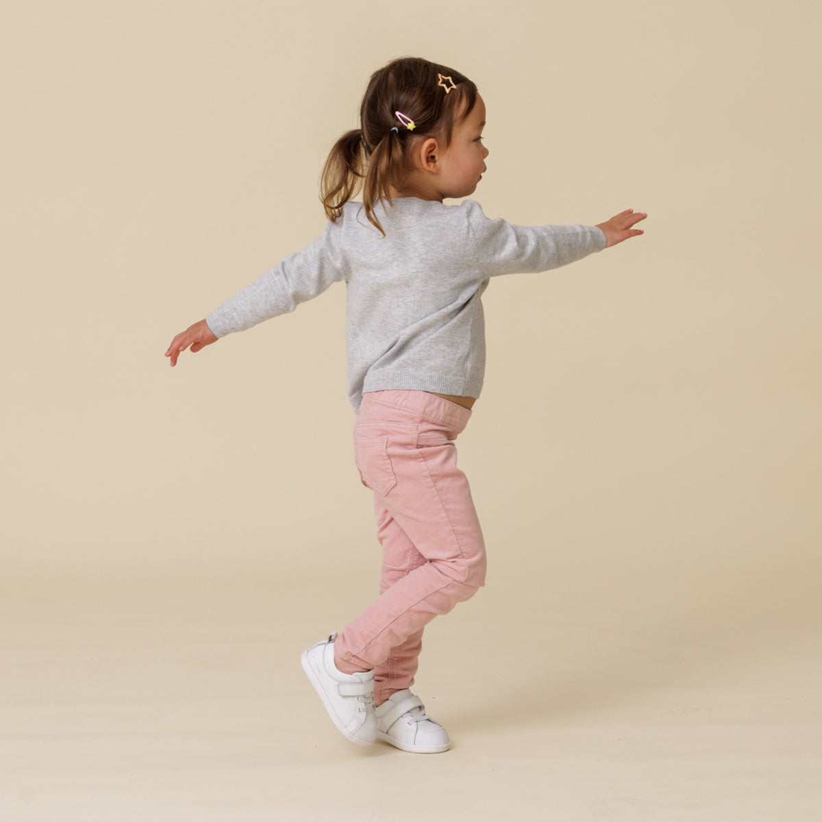 Baby walking, wearing 1st walker white shoes