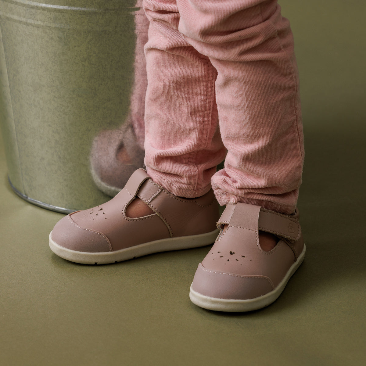 baby girl wearing pretty brave shoes in blush