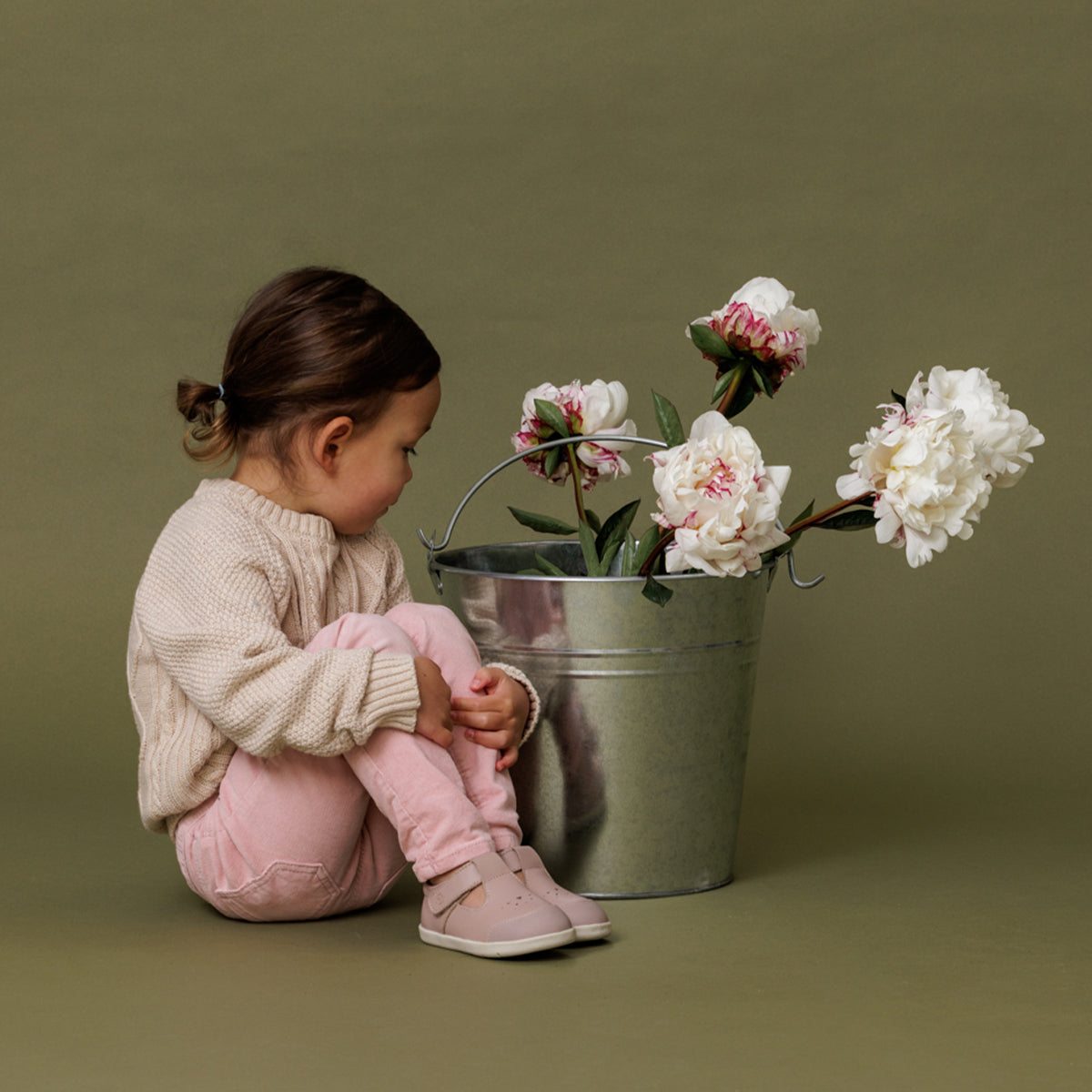 baby girl wearing pretty brave shoes in blush