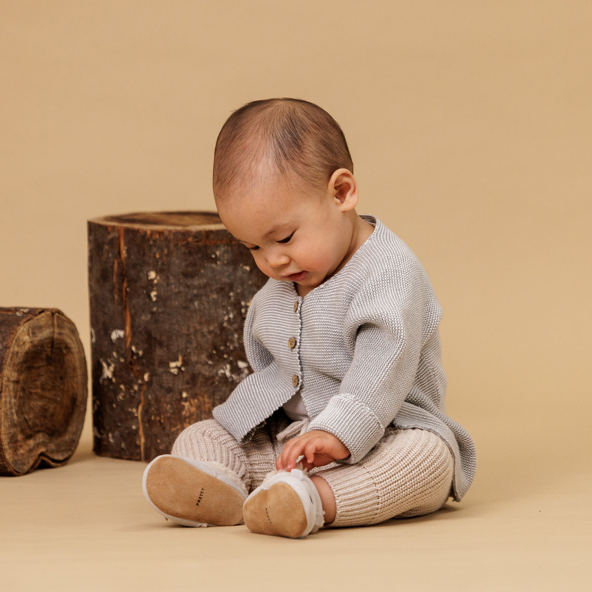 Baby wearing winter cosy fur baby shoes