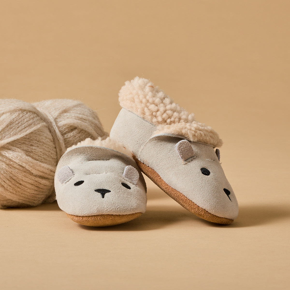 Baby wearing winter cosy fur baby shoes:image,small_image,thumbnail
