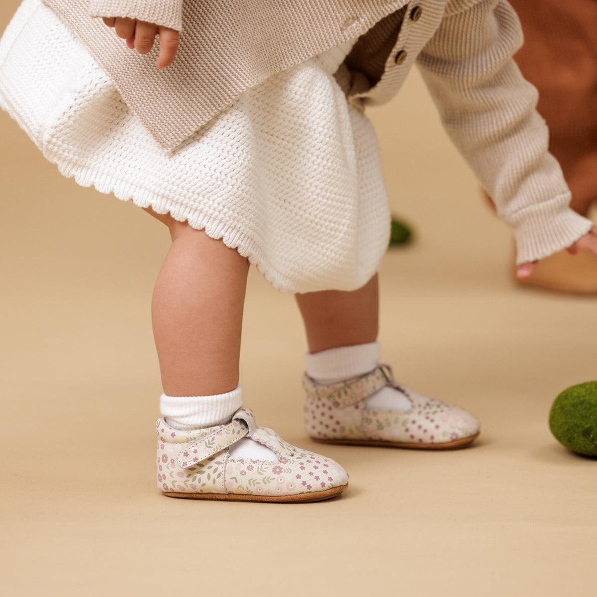 Girl wearing floral print baby shoes