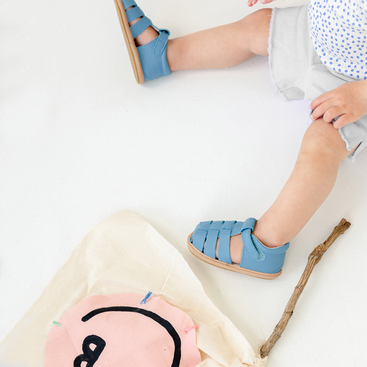 Pretty Brave Rio Baby Sandals in Playground Blue close up being worn