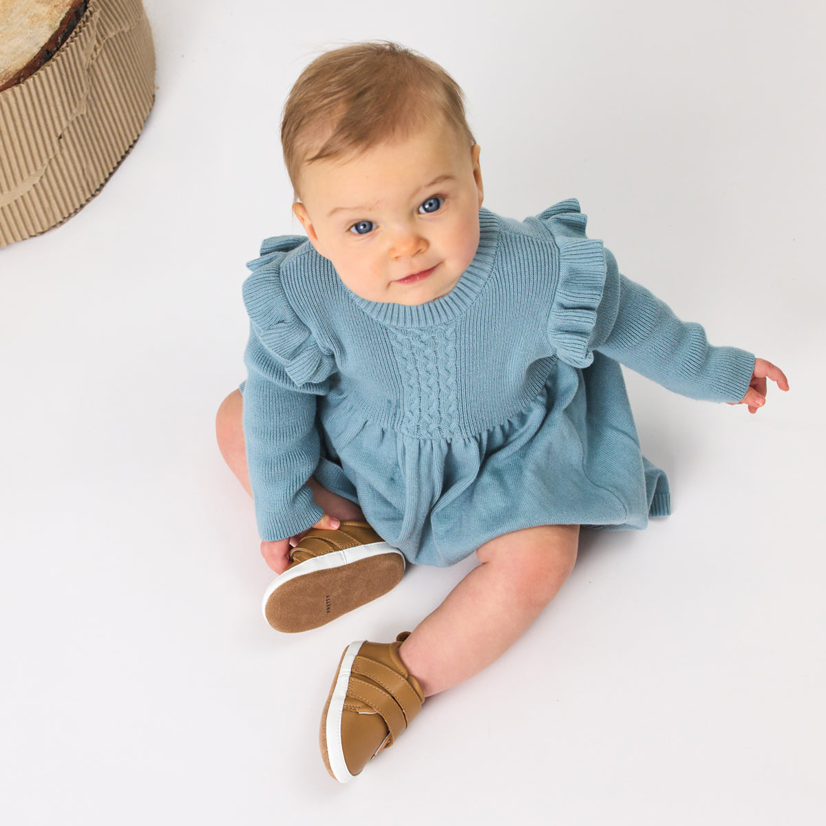 Unisex Baby Scout in tan from Pretty Brave on a baby feet
