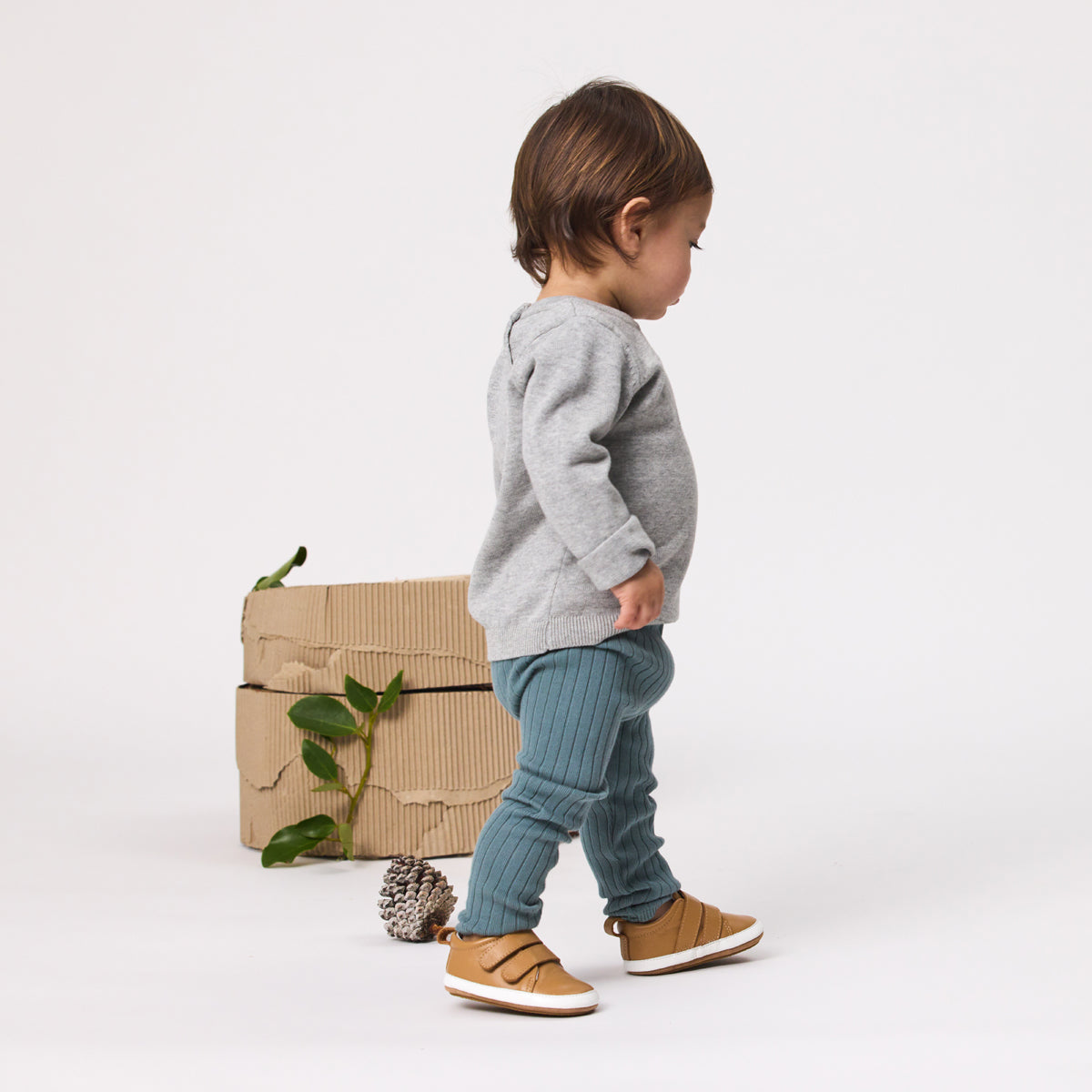 Baby boy standing wearing Unisex Baby Scout in tan from Pretty Brave