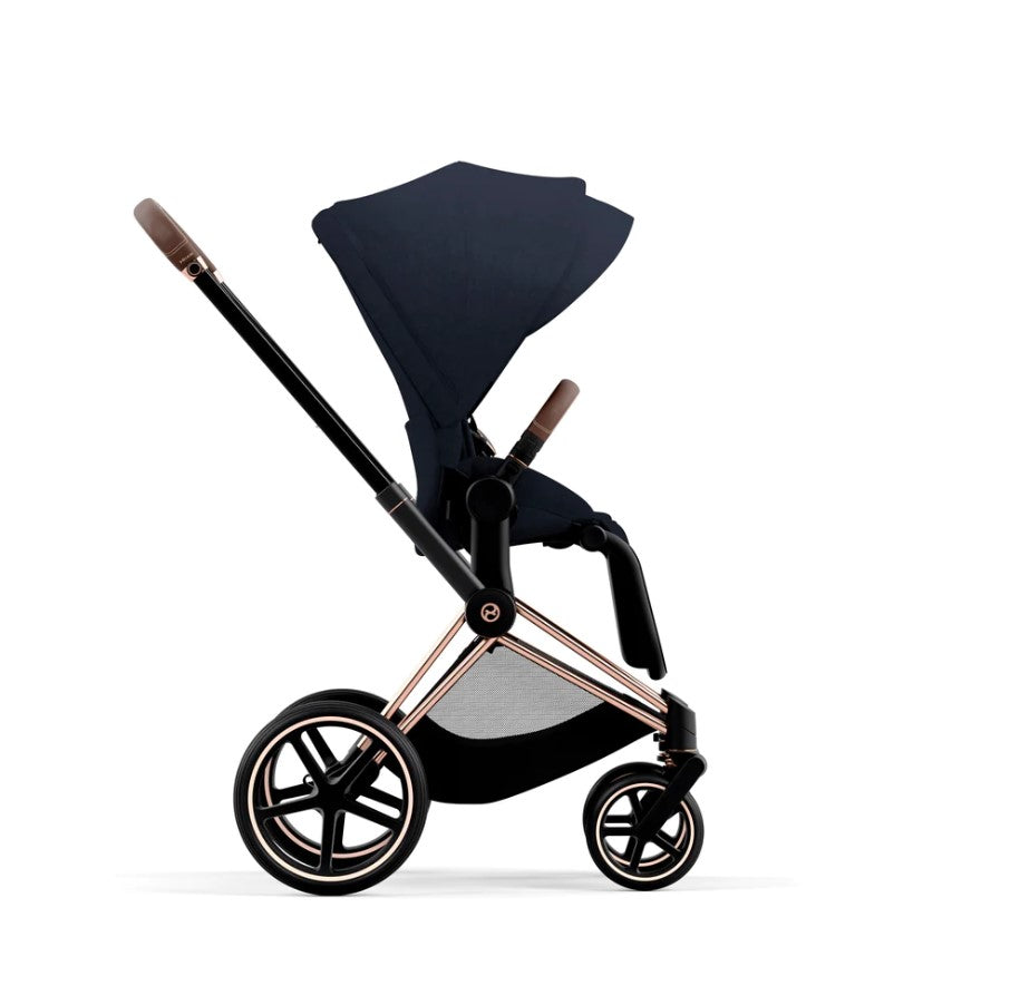 Priam Pram 2022. Rose Gold + Midnight Blue Plus side facing forward