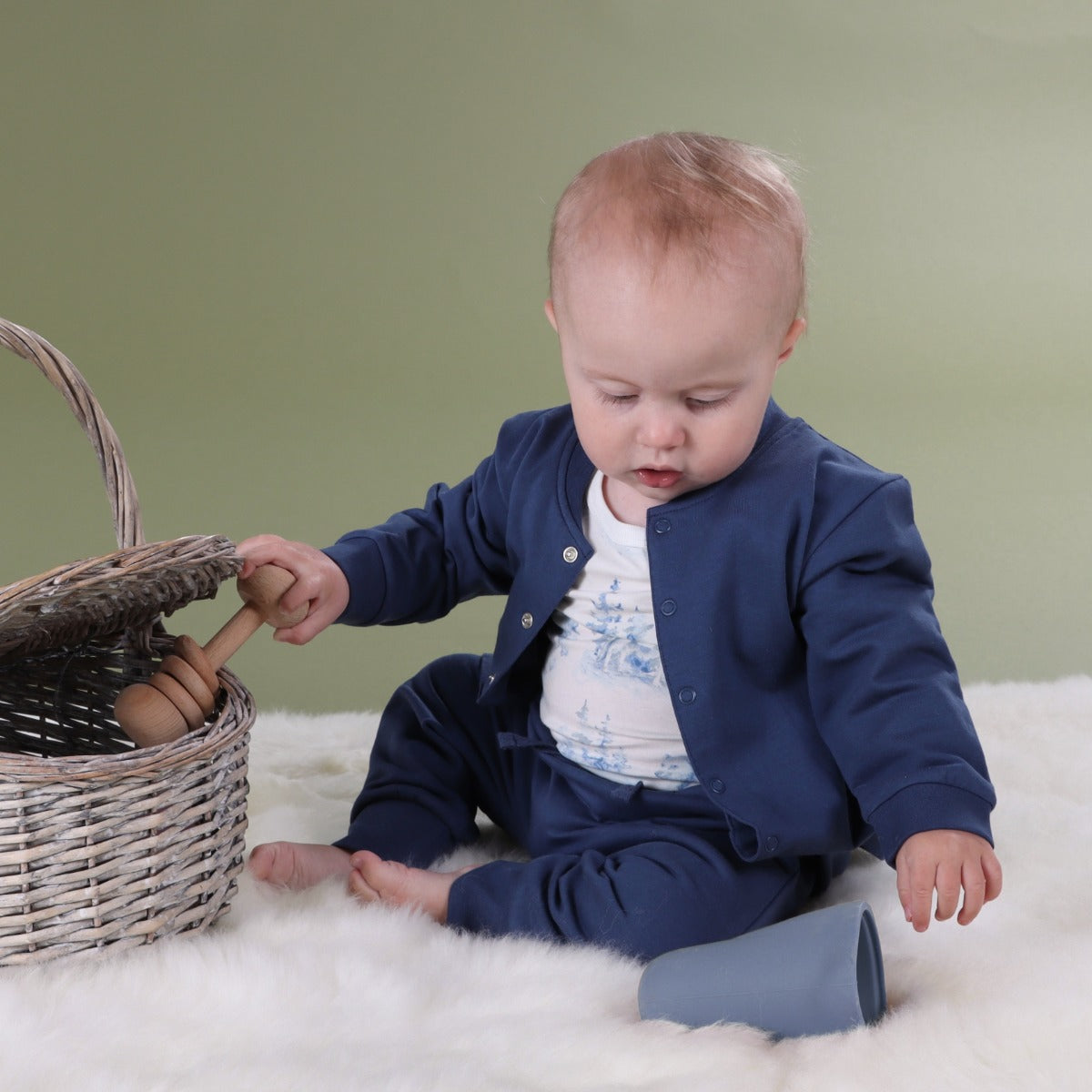 Baby playing wearing cotton navy jacket with pants and jungle print bodysuit