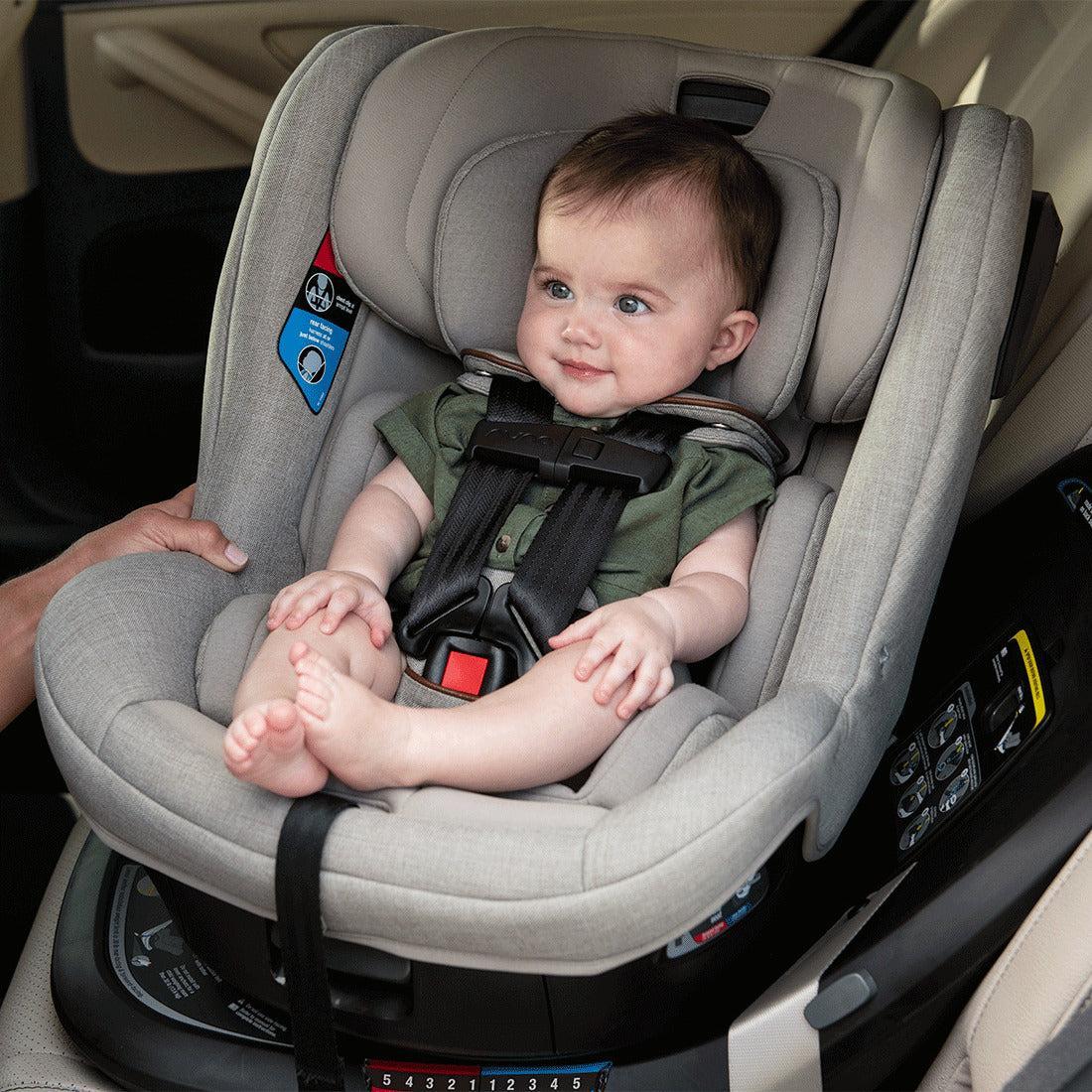 Baby sitting in Nuna Revv toddler car seat