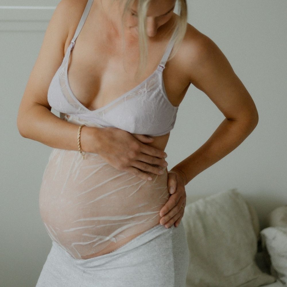 Woman using the Belly Hydration Mask