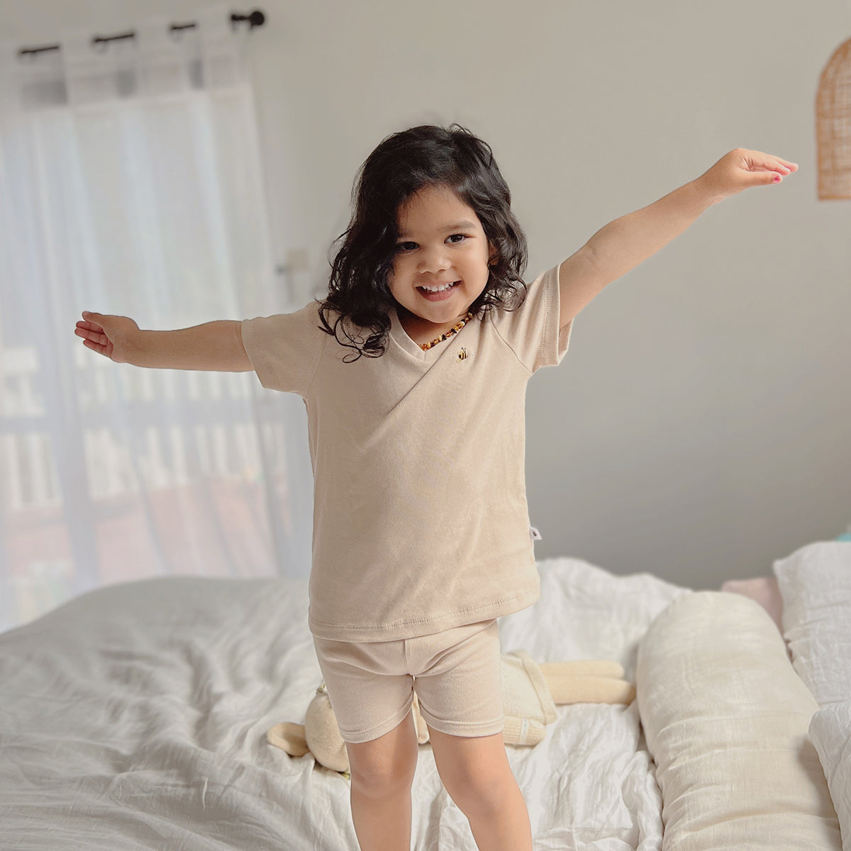 Little girl wearing little bee cotton t-shirt pairing it with shorts