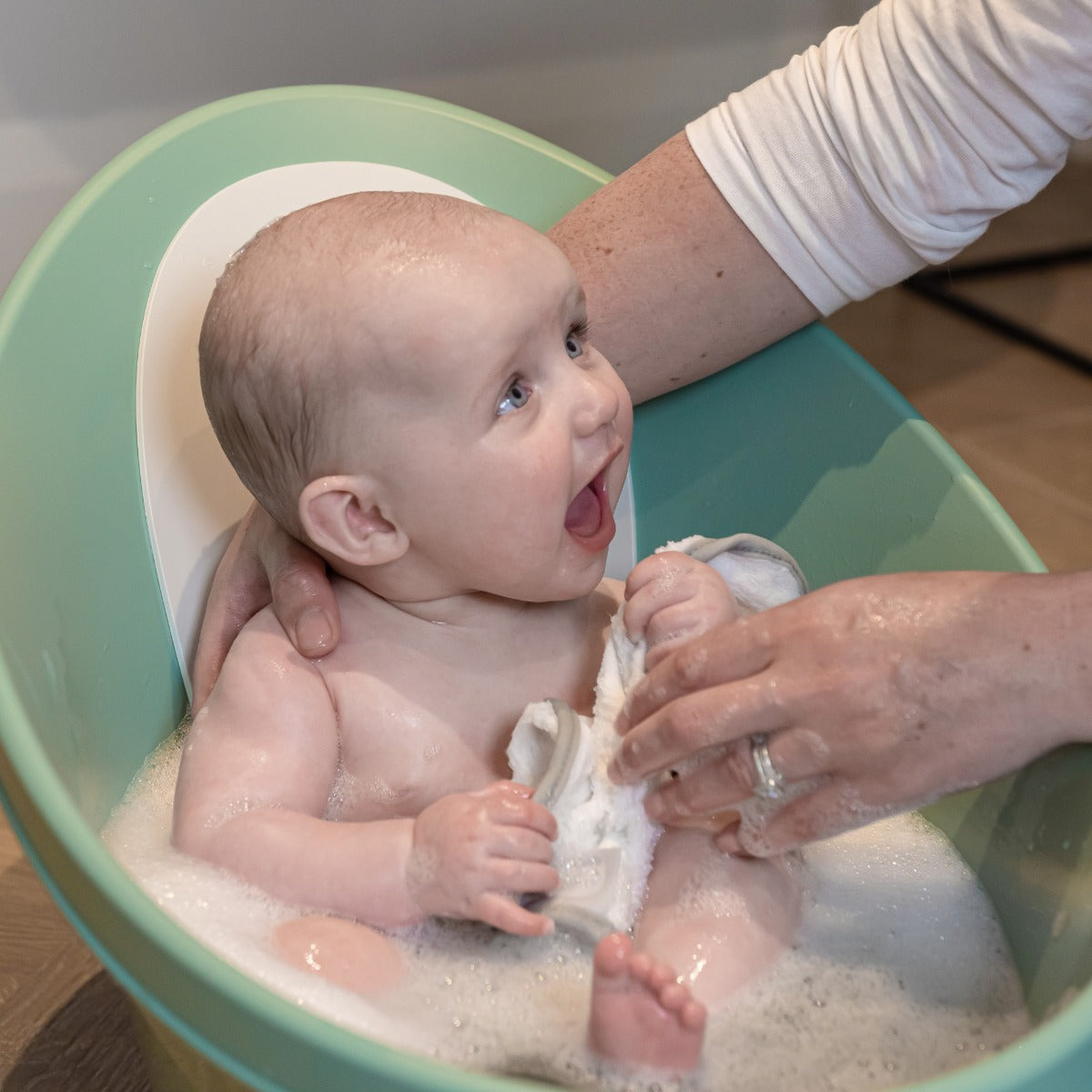 Happy child in Shnuggle Bath Eucalyptus