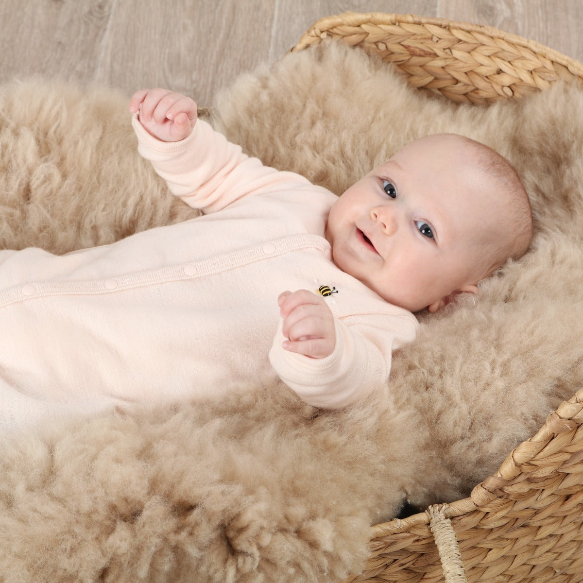 Dimples Snowglobe Merino Babygrow Eggnog bee on baby