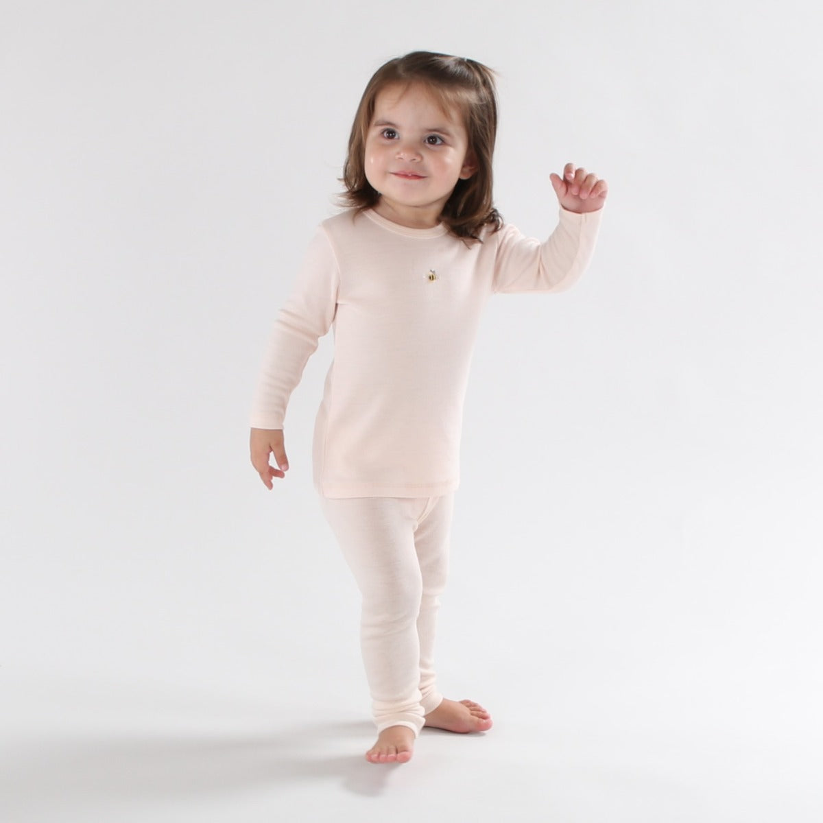 Baby wearing merino wool legging and top