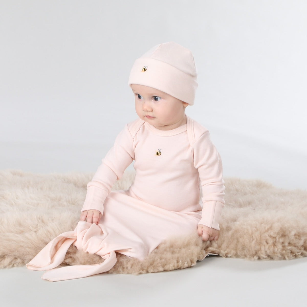 Dimples Snowglobe Merino Gown Eggnog on baby