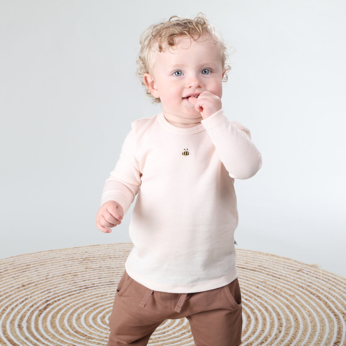 Dimples Snowglobe Merino Long Sleeve Top Eggnog on baby