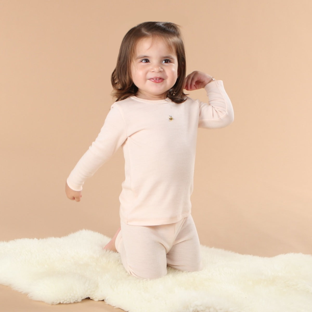 Dimples Snowglobe Merino Long Sleeve Top Eggnog on baby